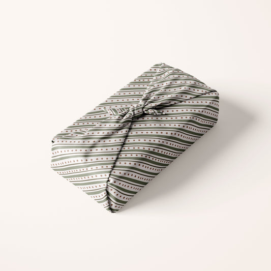 Striped Christmas Patterned fabric gift wrap on a white background