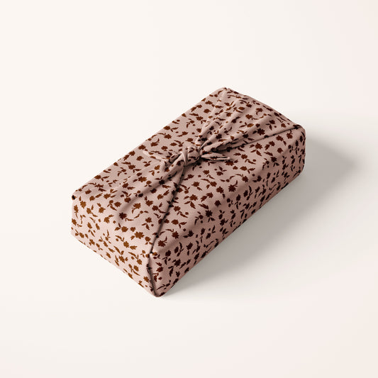 Rectangular gift wrap with blush floral pattern on a white background