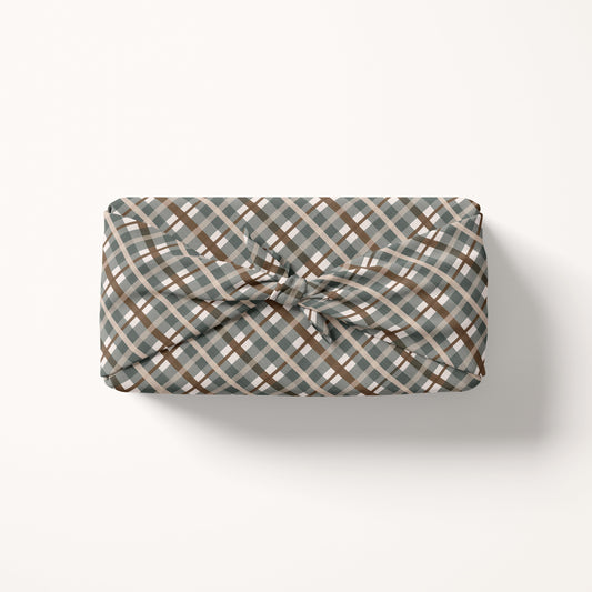 Gift wrap fabric with a plaid pattern on a white background