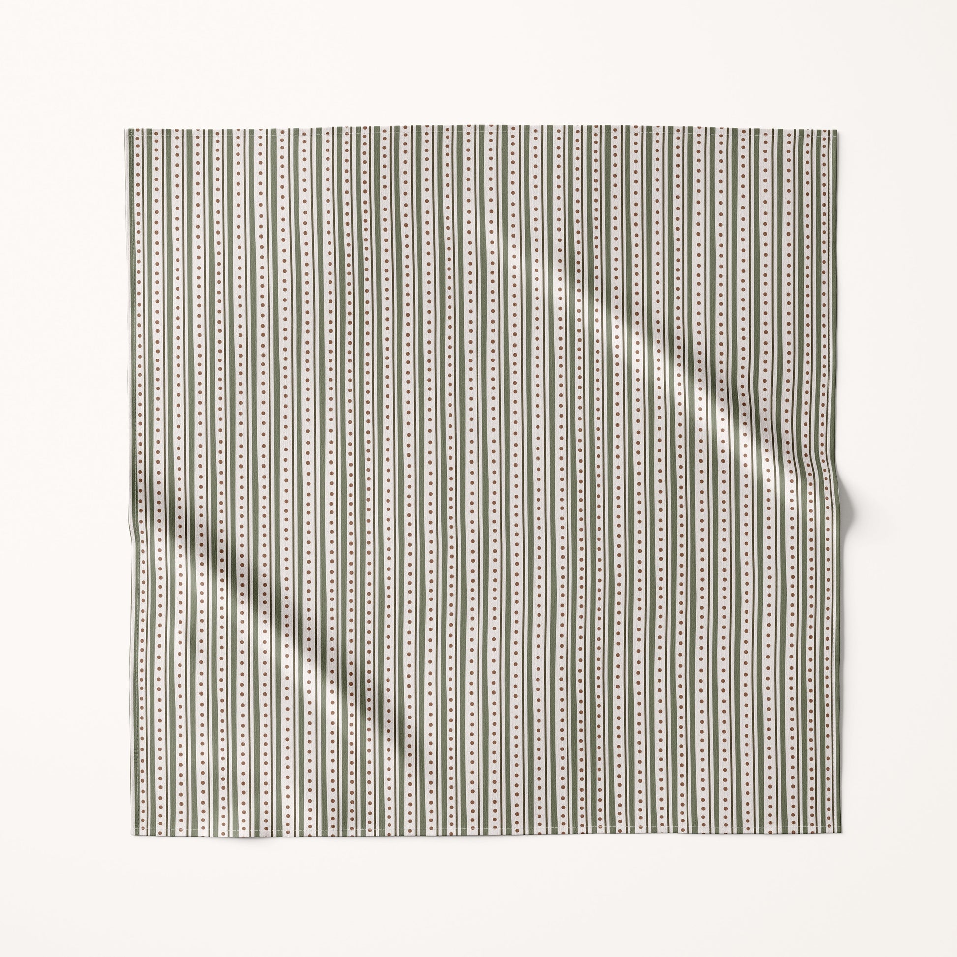 Christmas green stripes fabric square with a subtle pattern on a cream background