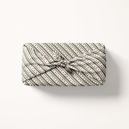 Christmas striped fabric gift wrap with a striped pattern on a white background