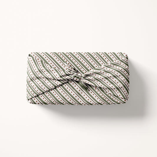 Christmas striped fabric gift wrap with a striped pattern on a white background