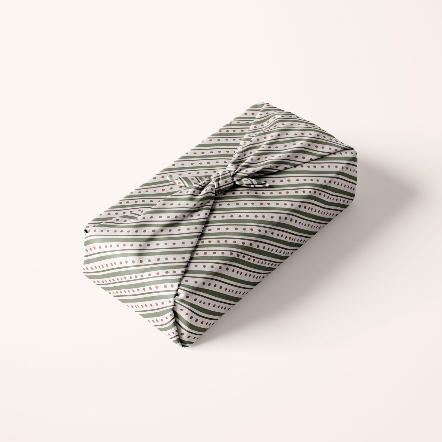 Striped Christmas Patterned fabric gift wrap on a white background