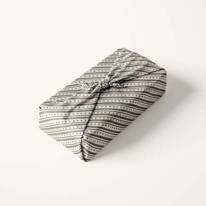 Striped Christmas Patterned fabric gift wrap on a white background