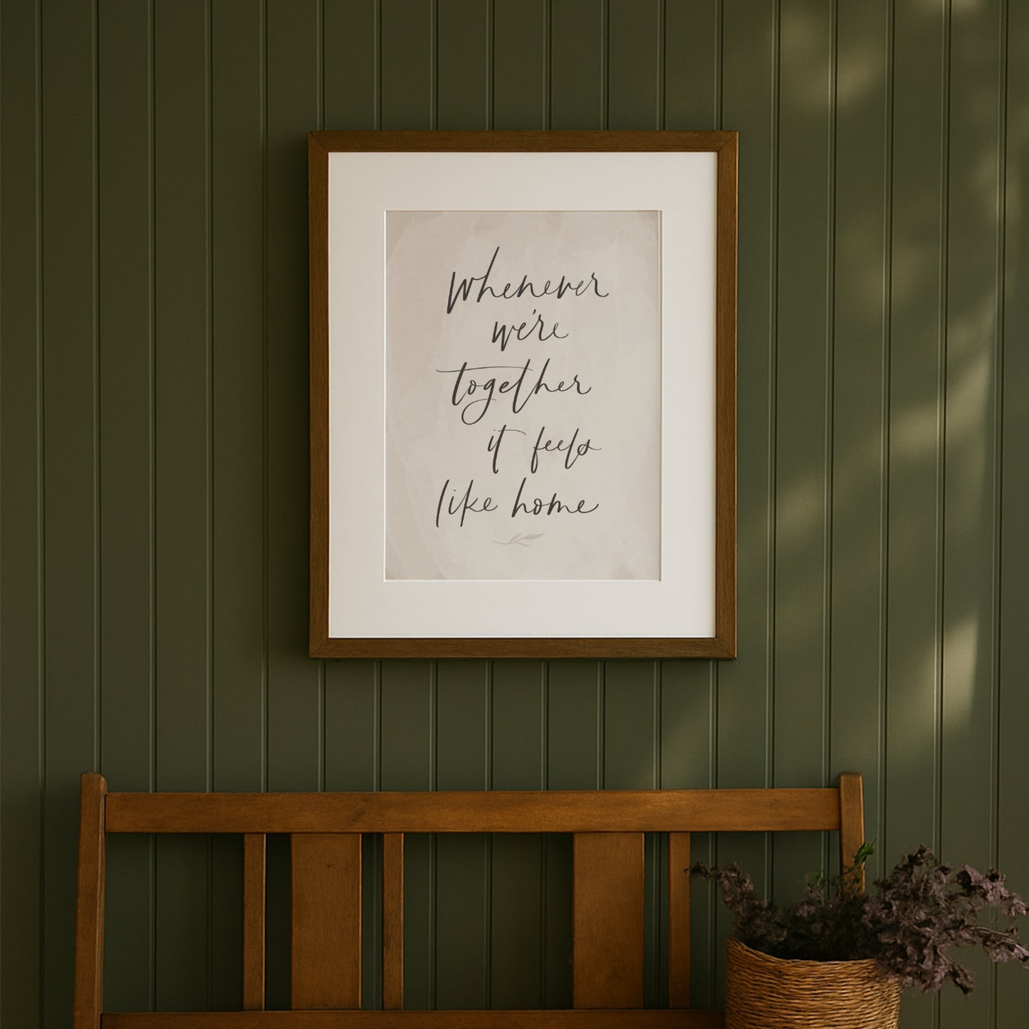 Framed artwork with text on a green wall above a wooden bench. hand lettered family quote art print saying whenever were together