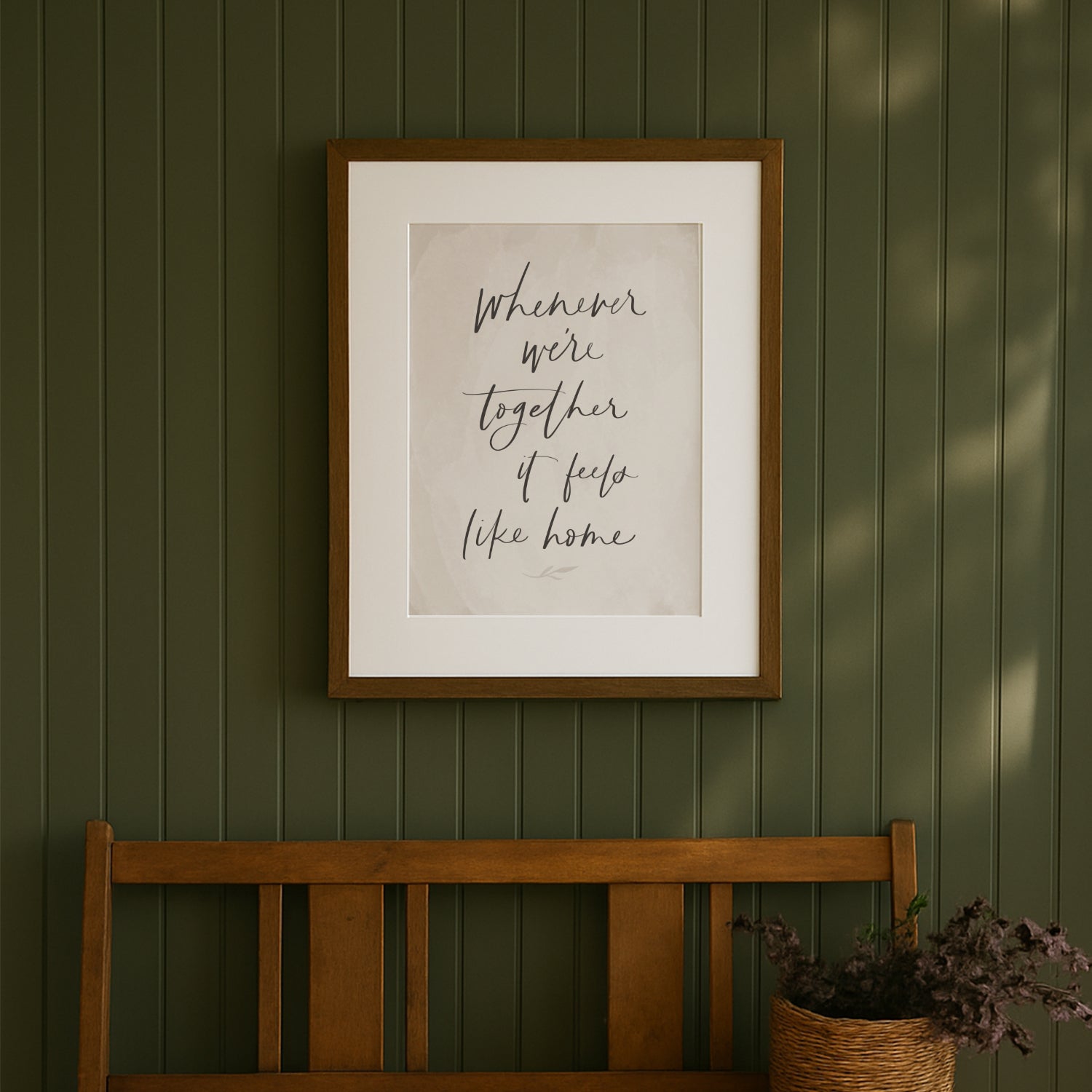 Framed artwork with text on a green wall above a wooden bench. hand lettered family quote art print saying whenever were together